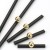 Möbelgriff Nigua – schwarzer länglicher Griff mit dekorativer goldener Kugel für Schränke und Schubladen, moderner Aufsatzgriff, erhältlich im Shop egriffe.at