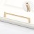 Möbelgriff Loma – schlichter Griff und runder Knopf in gebürstetem Gold, Größe 128 mm, für Schränke und Schubladen, erhältlich im Shop egriffe.at