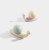 KinderMöbelgriff Caracol in Schneckenform. Pastellrosa oder Pastellgrün schmückt Schränke, Kommoden und Schubladen im Kinderzimmer und verbindet praktische Funktion mit kreativer, moderner Dekoration.