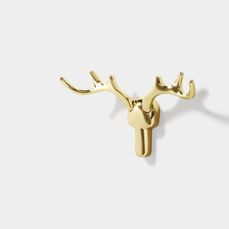 Wandhaken Alberto im modern-skandinavischen Stil, mit solider Konstruktion und einfacher Montage. Farben: Gold, gebürstetes Gold, Schwarz, Grau-Gold, Perlgrau und gebürsteter Nickel – dekorativ und funktional.