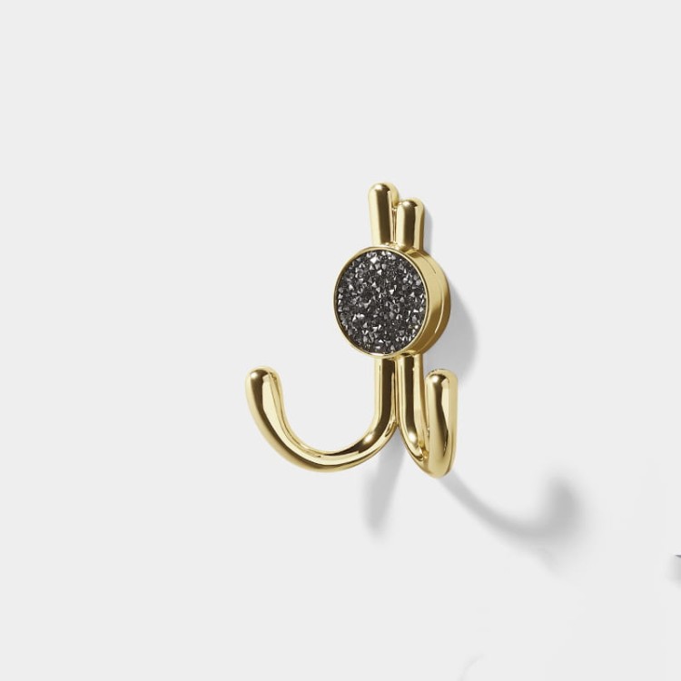 Wandhaken Rosa mit Doppelhaken und dekorativen diamantartigen Enden. Elegant, feuchtigkeitsbeständig, in vielen Gold-, Schwarz-, Silber- und Grautönen erhältlich – für Zuhause und gewerbliche Innenräume.
