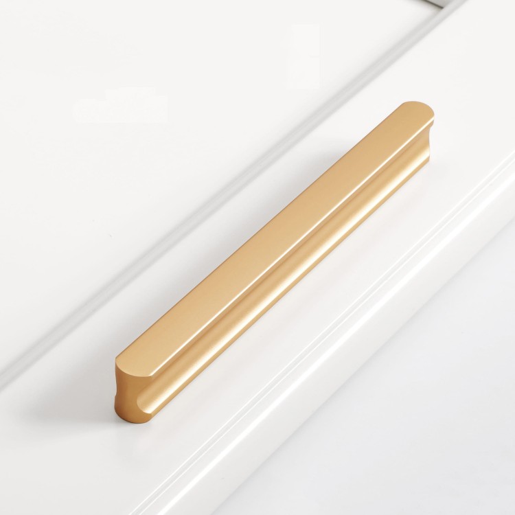 Elegancki złoty uchwyt meblowy Tapia do kuchennych szuflad rozmiar 128 mm