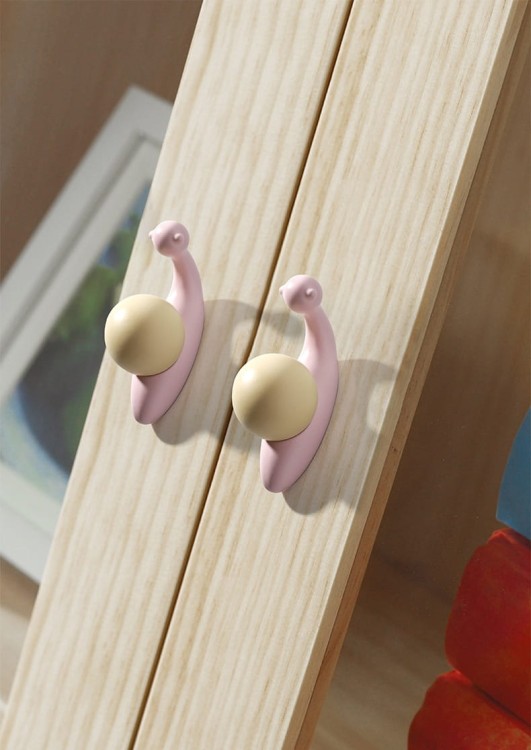 KinderMöbelgriff Caracol in Schneckenform. Pastellrosa oder Pastellgrün schmückt Schränke, Kommoden und Schubladen im Kinderzimmer und verbindet praktische Funktion mit kreativer, moderner Dekoration.
