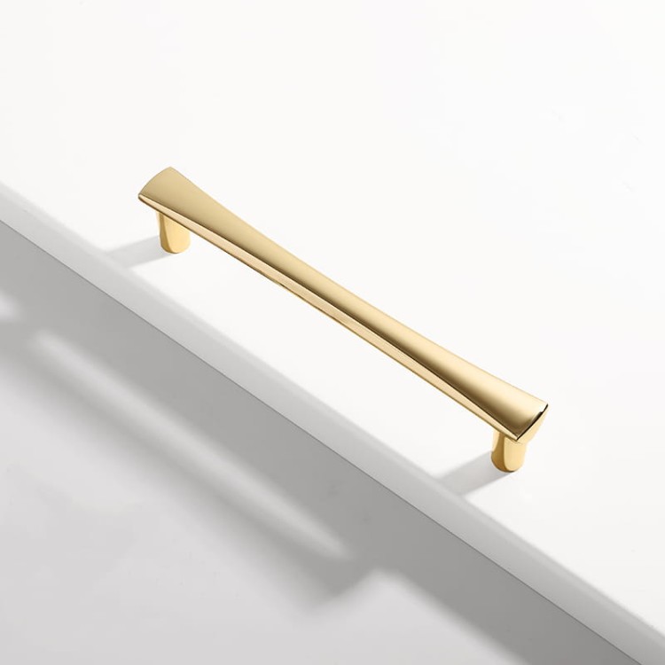 Möbelgriff Tuse – schlanker moderner Griff in Gold und Perlgrau, erhältlich in 128 mm, 192 mm sowie als Knopf. Ideal für elegante Küchenmöbel, Schubladen, Kommoden und Garderoben im klassischen oder modernen Stil.