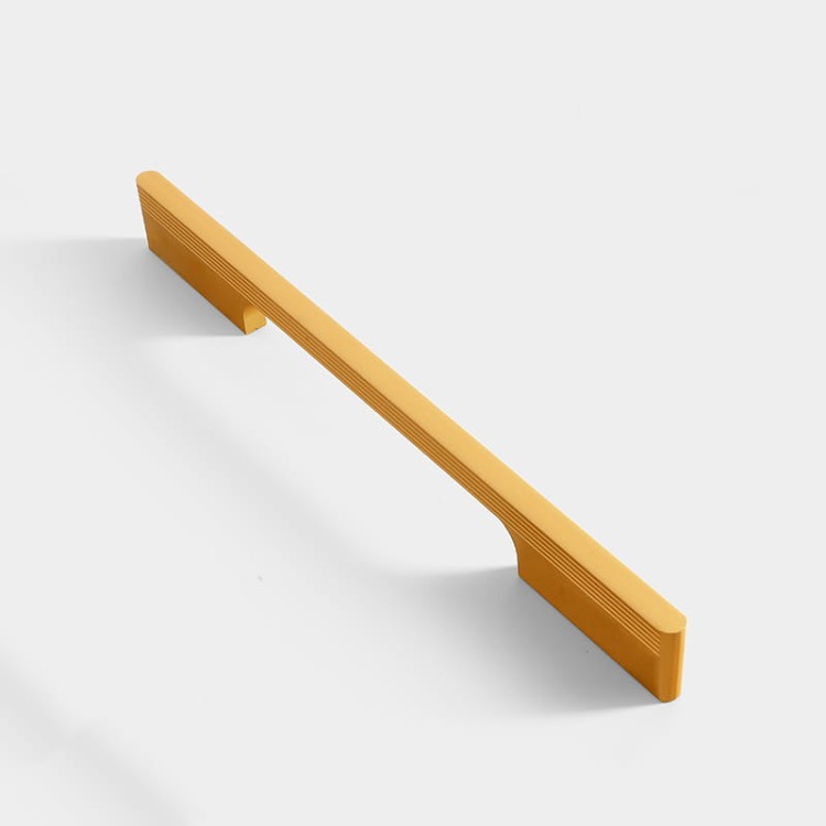 Elegancki uchwyt meblowy Pomo w kolorze szampańskiego złota, rozstaw 192 mm
